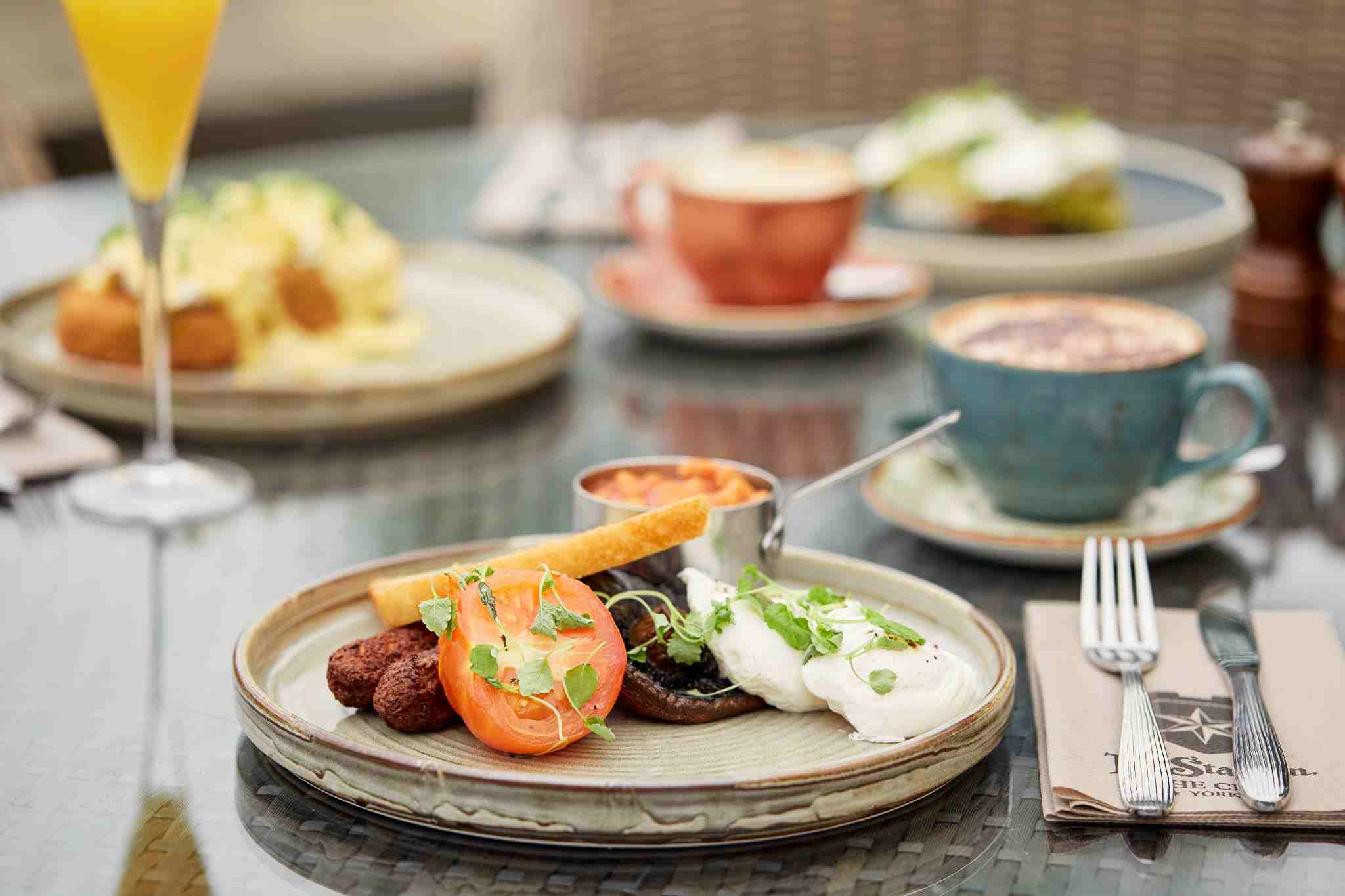 Star in the city's english breakfast including toast. beans, eggs, mushroom, and sausages