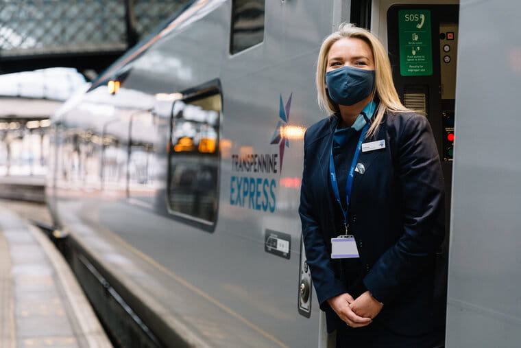 TransPennine Express staff member on train platform