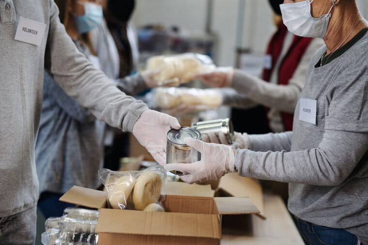 Volunteers sorting food at a food bank