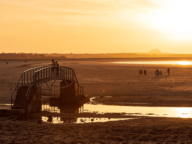 Belhaven bay at sunset with a bridge to nowhere