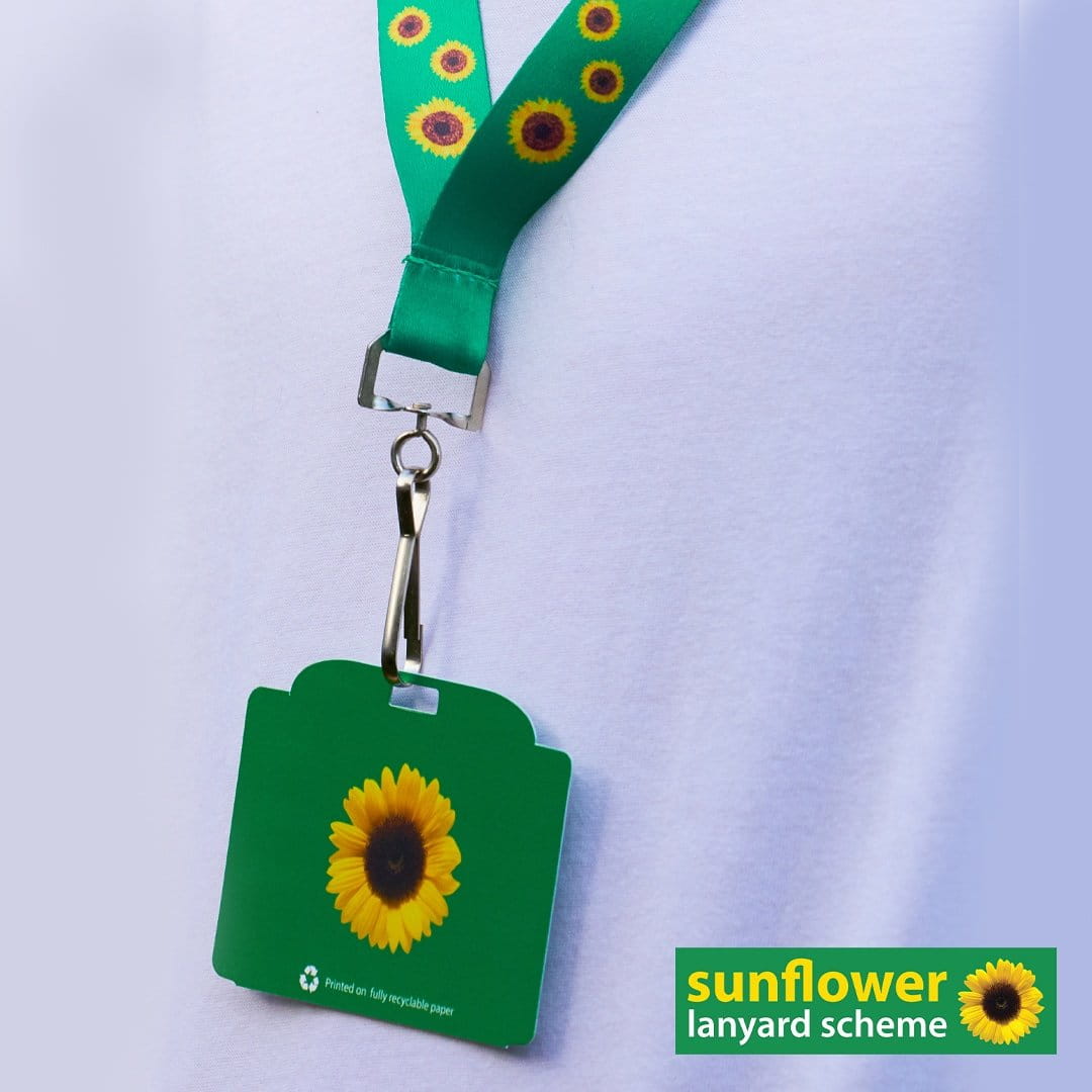 A sunflower lanyard with card attached promoting the sunflower lanyard scheme.